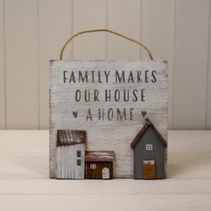 White Wooden Home Sign 'Family Makes Our House A Home' With Grey White and Brown Stand Out Houses