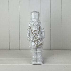 Glazed Ceramic Nutcracker Ornament With Textured Detail