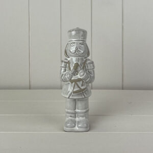 Glazed Ceramic Nutcracker Ornament With Textured Detail