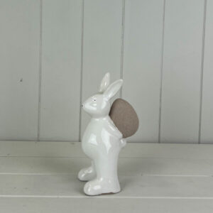 Ceramic White Rabbit holding an Egg