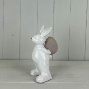Ceramic White Rabbit holding an Egg