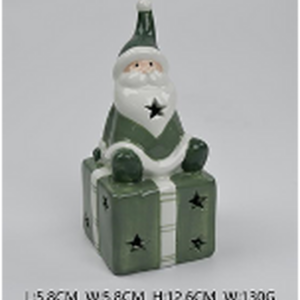 Nordic Green Santa sitting on LED Present