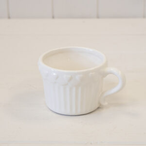 White Ribbed Ceramic Cup and Saucer with Heart Pattern